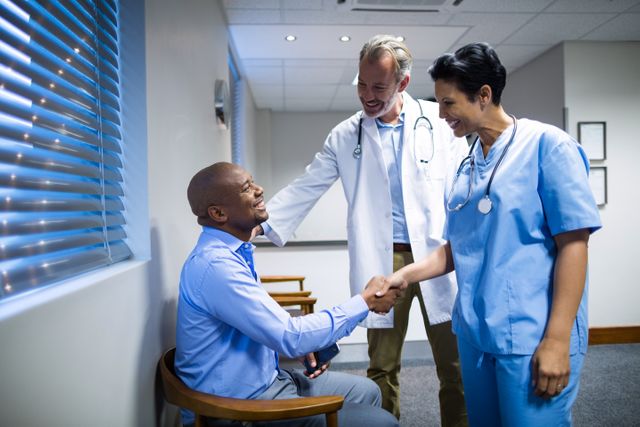 Doctors shaking hands with patient - Download Free Stock Photos Pikwizard.com