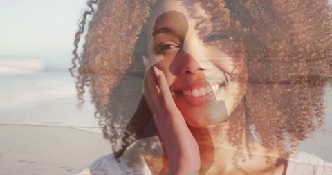 Smiling Woman with Silhouette on Beach at Sunrise