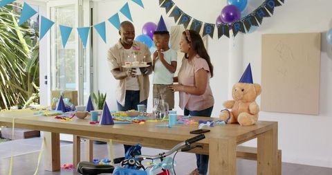 Diverse Family Celebrating Child's Birthday at Home