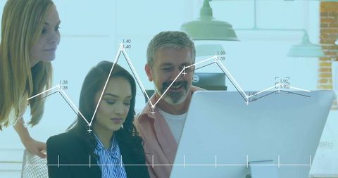 Team analyzing data chart on office computer for collaborative project
