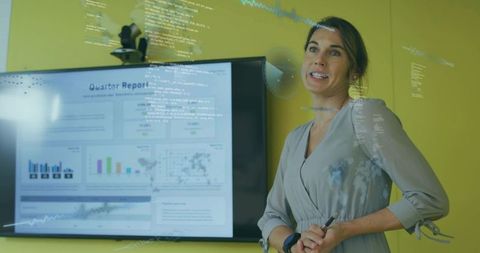 Confident female consultant presenting data insights in office