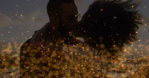 Romantic embrace at sunset with magical bokeh effect