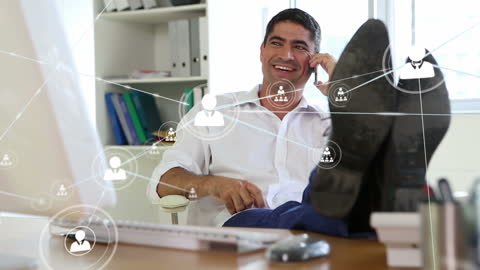 Businessman Smiling with Network Icons on Screen