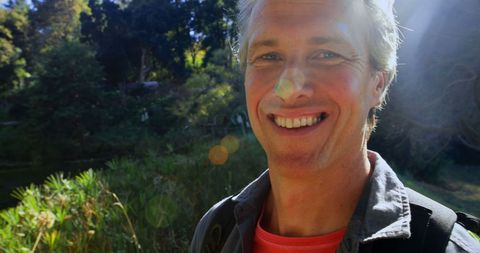 Cheerful Man Enjoying Outdoor Nature Hike with Backpack - Download Free Stock Images Pikwizard.com
