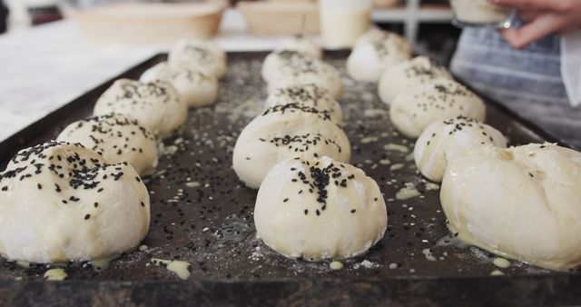 Baking Fresh Bread Rolls Topped with Black Sesame Seeds - Download Free Stock Images Pikwizard.com