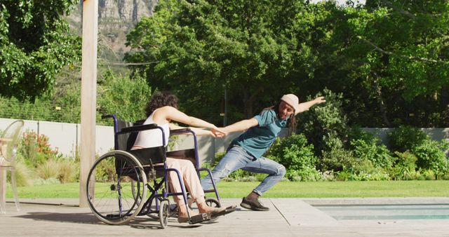 Cheerful Disabled Woman and Friend Having Fun Outdoors by Poolside - Download Free Stock Images Pikwizard.com