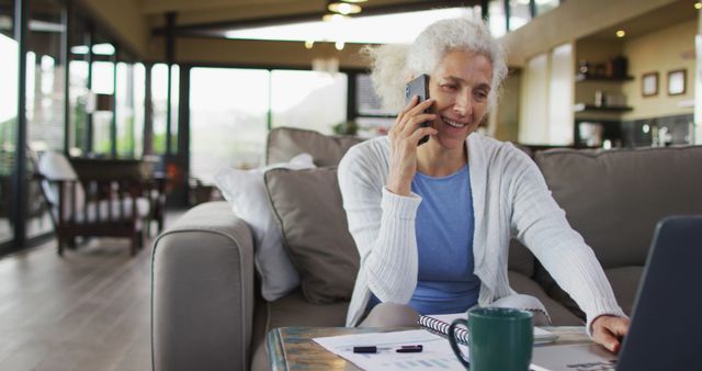 Senior Woman Working From Home on Laptop, Smiling, Talking on Phone - Download Free Stock Images Pikwizard.com