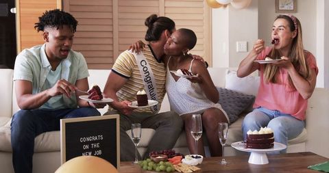 Friends Celebrate New Job Milestone with Cake and Joyful Gathering