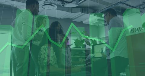 Business colleagues analyzing data with digital graph overlay