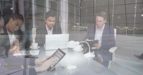 Business Team Collaborating with Digital Interfaces