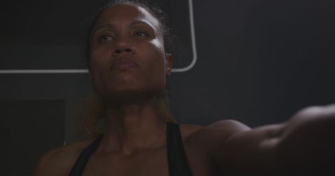 Determined African American Woman Exercising with Resistance Band