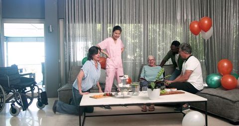 Multicultural Healthcare Team Assisting Patients in Rehabilitation Center