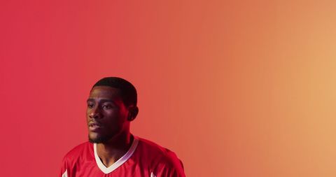 Focused Athlete Taking Break in Dynamic Red Attire