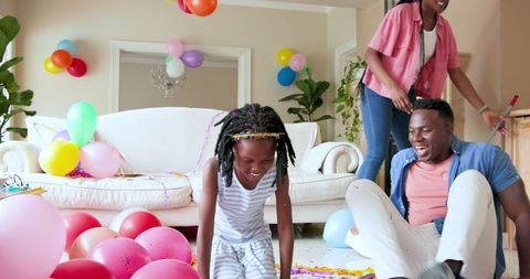 Joyful Family Cleaning After Birthday Celebration at Home