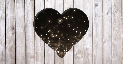 Heart shaped starry cutout on rustic wood