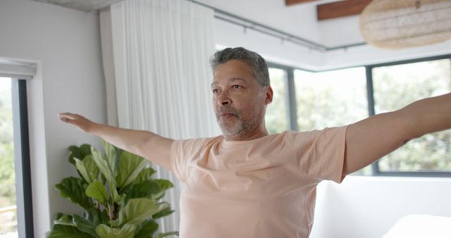 Man Practicing Yoga at Home in Bright Room - Download Free Stock Images Pikwizard.com