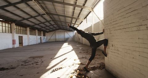 Contemporary Ballet Dancer in Sunny Abandoned Warehouse - Download Free Stock Images Pikwizard.com
