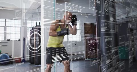 Athlete Boxing Training with Futuristic Digital Interface in Gym