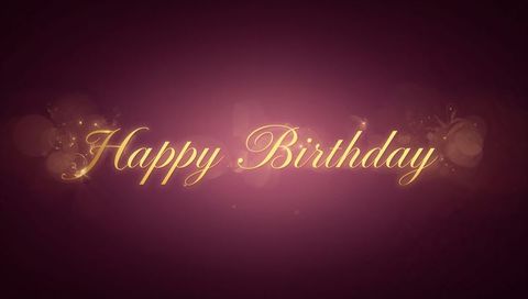 Luxurious Gold Cursive Happy Birthday Greeting with Sparkles and Bokeh
