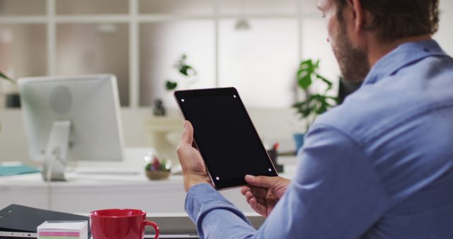 Man Using Digital Tablet at Office Desk - Download Free Stock Images Pikwizard.com