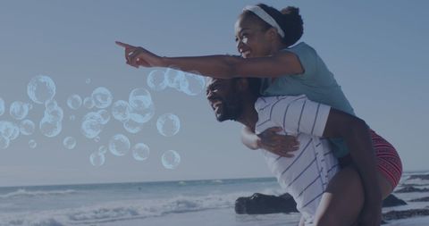 Joyful Couple Enjoying Beach with Digital Bubbles - Download Free Stock Images Pikwizard.com