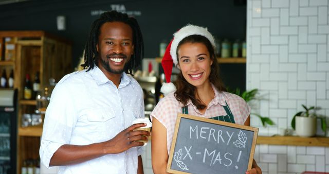 Smiling cafe owners celebrating Christmas holiday together - Download Free Stock Images Pikwizard.com