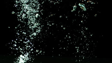 Vibrant Peppers Splashing in Water on Black Background