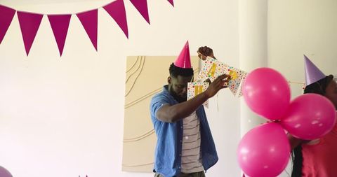 Father and Daughter Preparing for Colorful Birthday Celebration