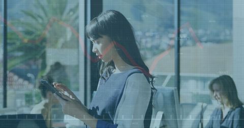 Businesswoman Analyzing Financial Data on Tablet in Office Environment