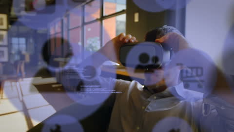 Man Experiencing Augmented Reality with VR Headset in Modern Office