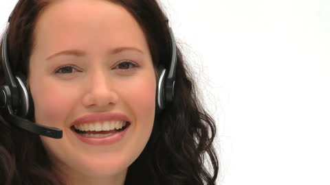 Professional Woman Smiling While Using Headset