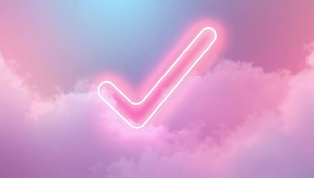 Glowing Neon Check Mark Against Dreamy Pastel Sky