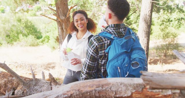 Young Friends Laughing and Chatting During a Forest Hike - Download Free Stock Images Pikwizard.com