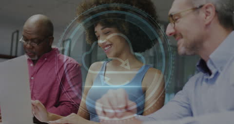 Diverse Colleagues Discussing Cybersecurity Concepts in Modern Office