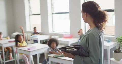 Teacher Instructing Diverse Classroom with Young Students - Download Free Stock Images Pikwizard.com