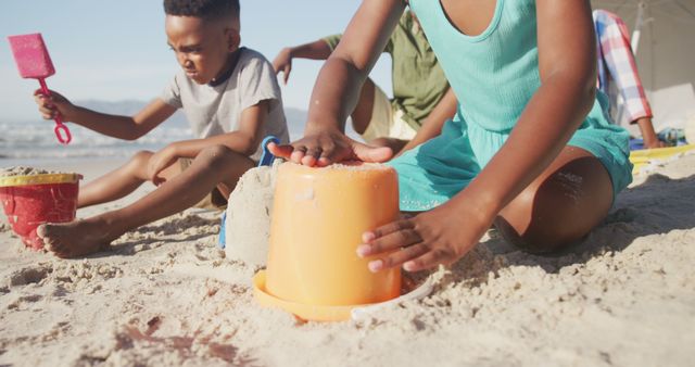 Children Playing with Sand on Sunny Beach - Download Free Stock Images Pikwizard.com