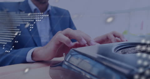 Businessman Analyzing Data on Laptop with Digital Globe Projection