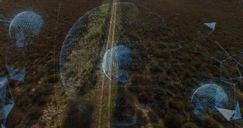 Futuristic Digital Mapping Globe Above Rural Terrain
