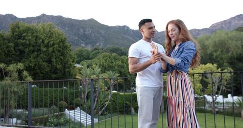 Engaged Couple Celebrating with Beautiful Ring in Scenic Garden