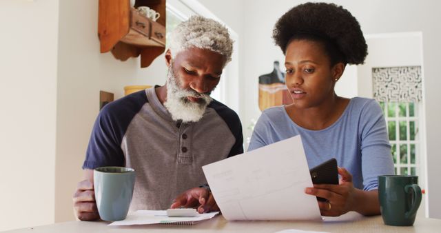 African American couple reviewing financial documents - Download Free Stock Images Pikwizard.com