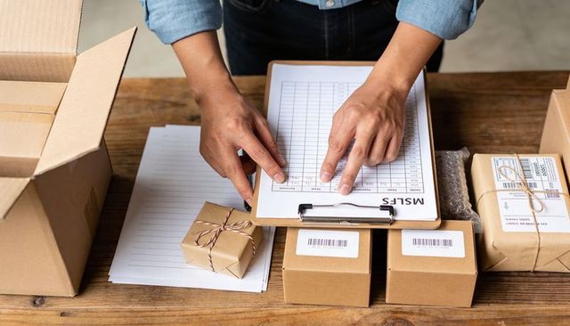Small Business Packing Station Checking Inventory Checklist for Fast Shipping Operations