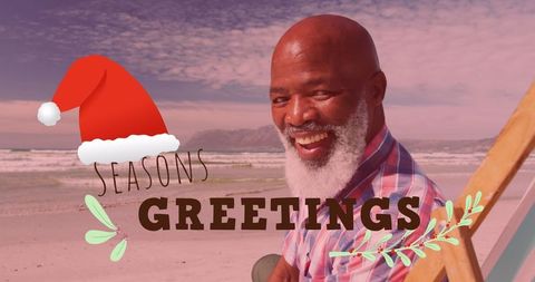 Smiling man beach santa hat seasonal greetings card design