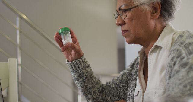 Senior Woman Examining Medical Sample at Home - Download Free Stock Images Pikwizard.com