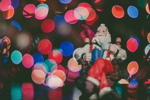 Festive Santa Figurine with Colorful Bokeh Lights