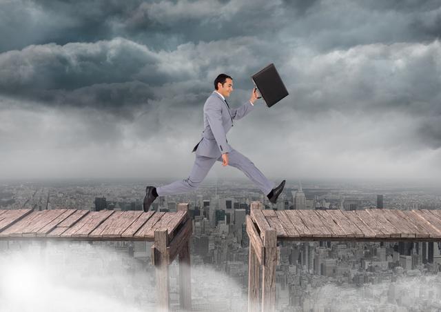 Businessman in a suit with briefcase jumping between wooden platforms above cityscape under cloudy sky. Represents risk-taking, overcoming challenges, business success, determination, leadership. Useful for business, motivational, and risk management themes.