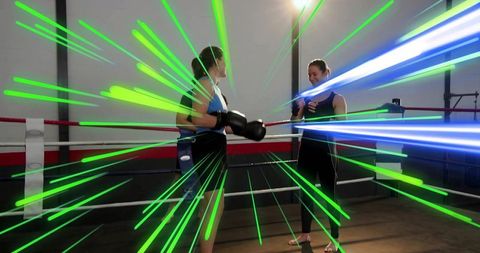 Female Boxers Sparring in Ring with Neon Motion Streaks Conveying Energy and Focus