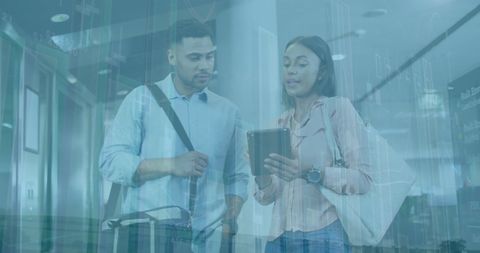 Professional Team Analyzing Data on Digital Tablet in Corporate Office