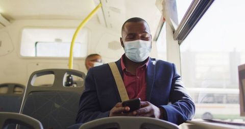 Urban Commuter Wearing Mask Using Smartphone Inside City Bus - Download Free Stock Images Pikwizard.com