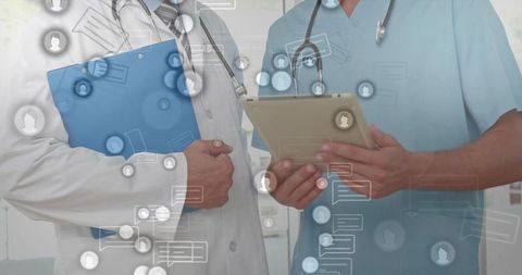 Healthcare Professionals Reviewing Digital Records on Tablet and Clipboard for Telehealth