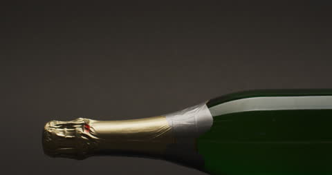 Close-up of Champagne Bottle on Dark Background for Celebration